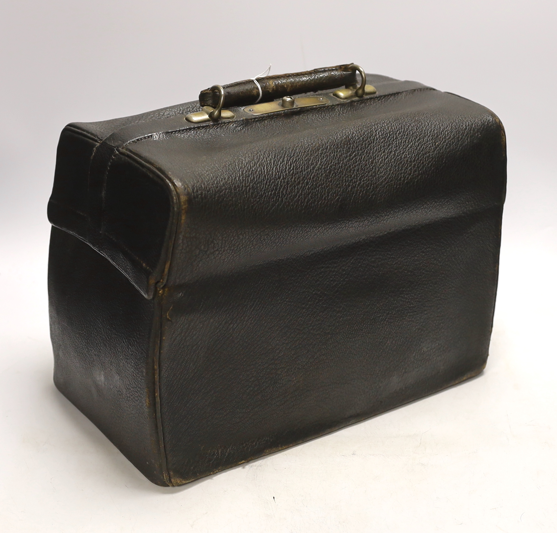 A black leather Gladstone bag